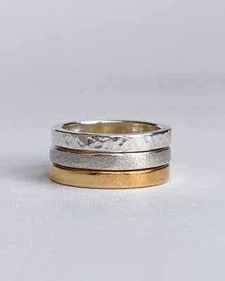 Stacking rings with textures in mixed metals.